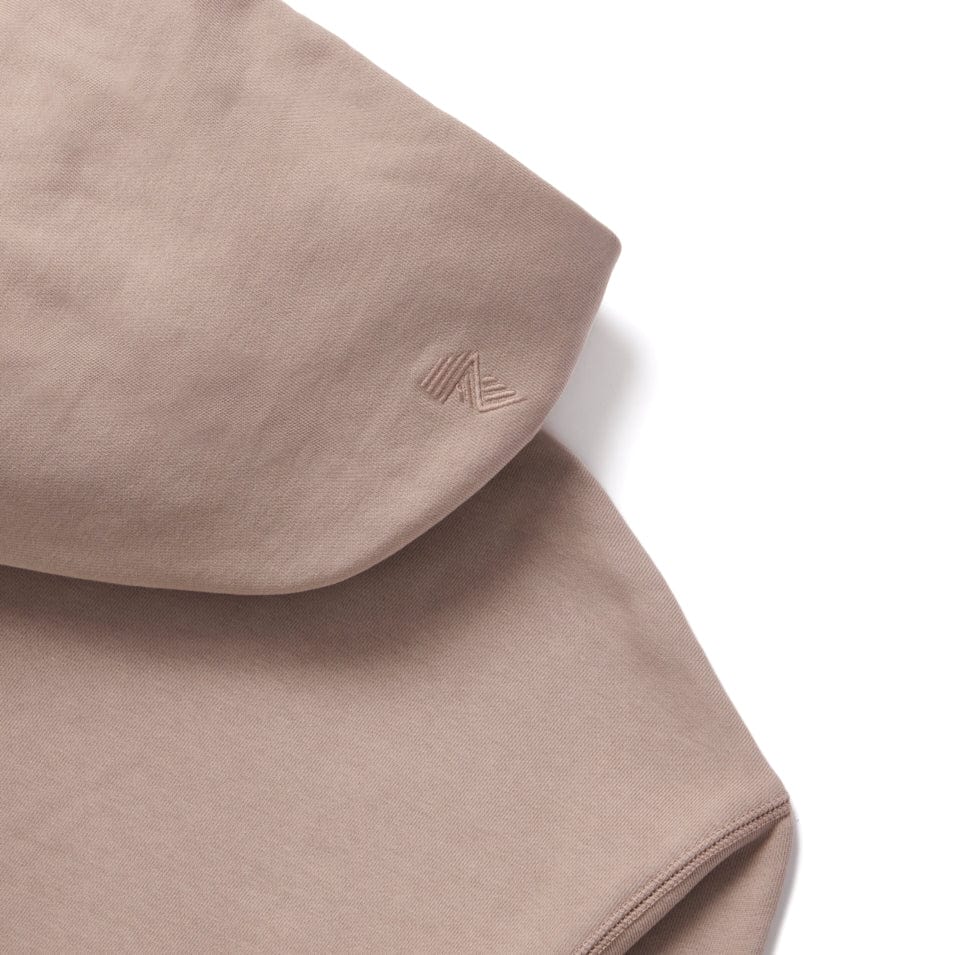 Beige hooded sweatshirt.