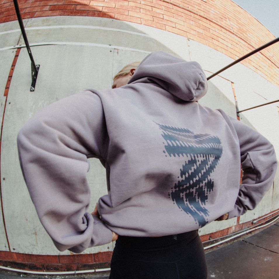 Lavender hoodie with patterned design.