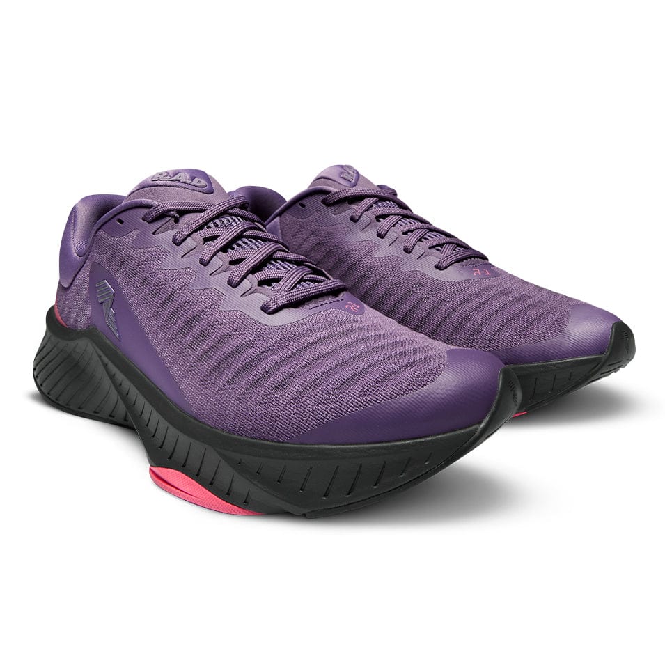 Purple running shoes with black soles.