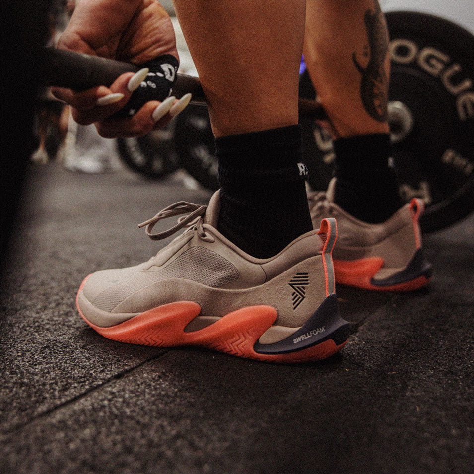 Tan and orange athletic shoes from the R.A.D® ONE V2 DUST ORANGE collection