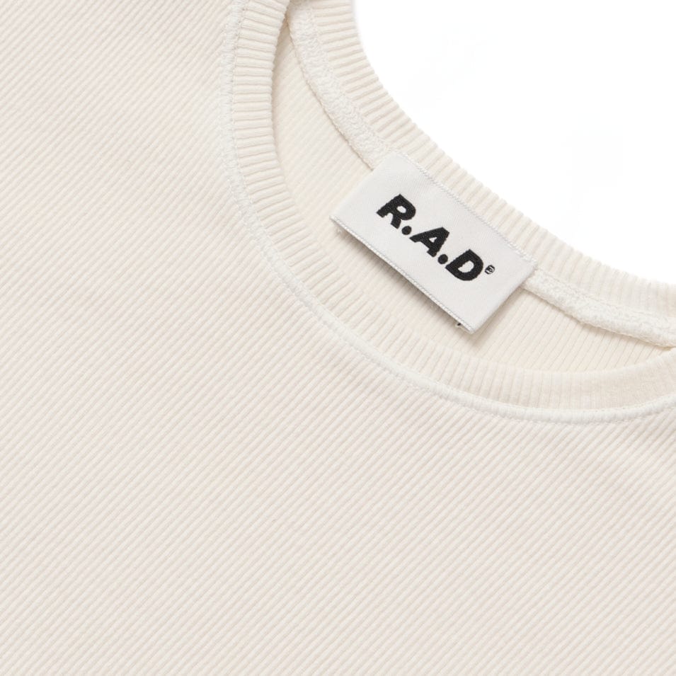 White knit shirt with brand label.