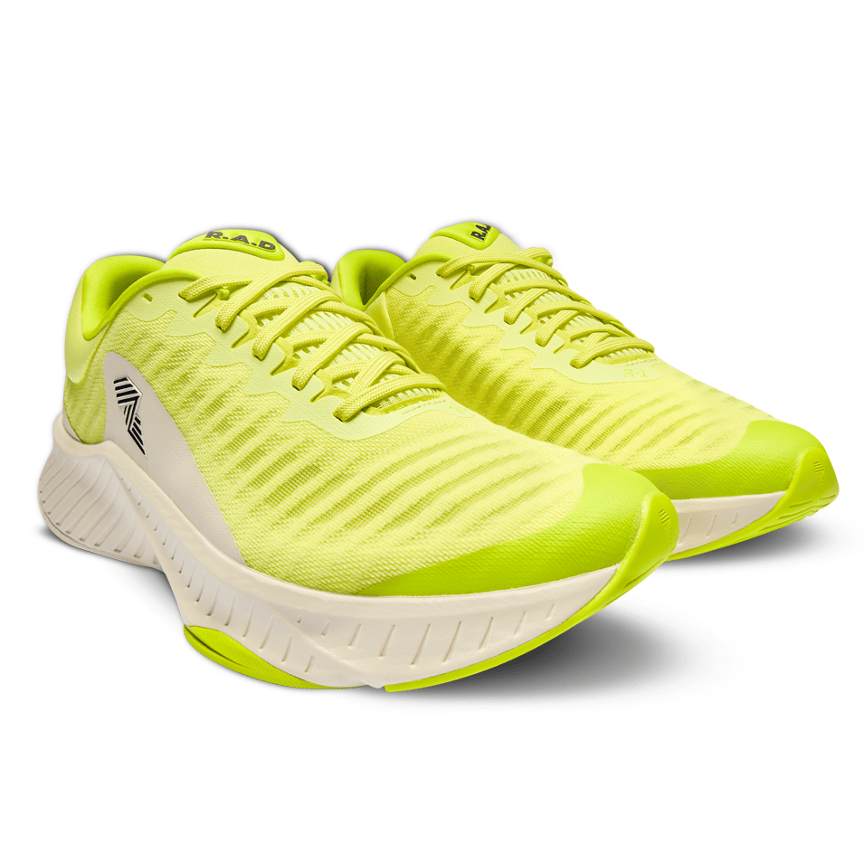 Pair of bright yellow running shoes.