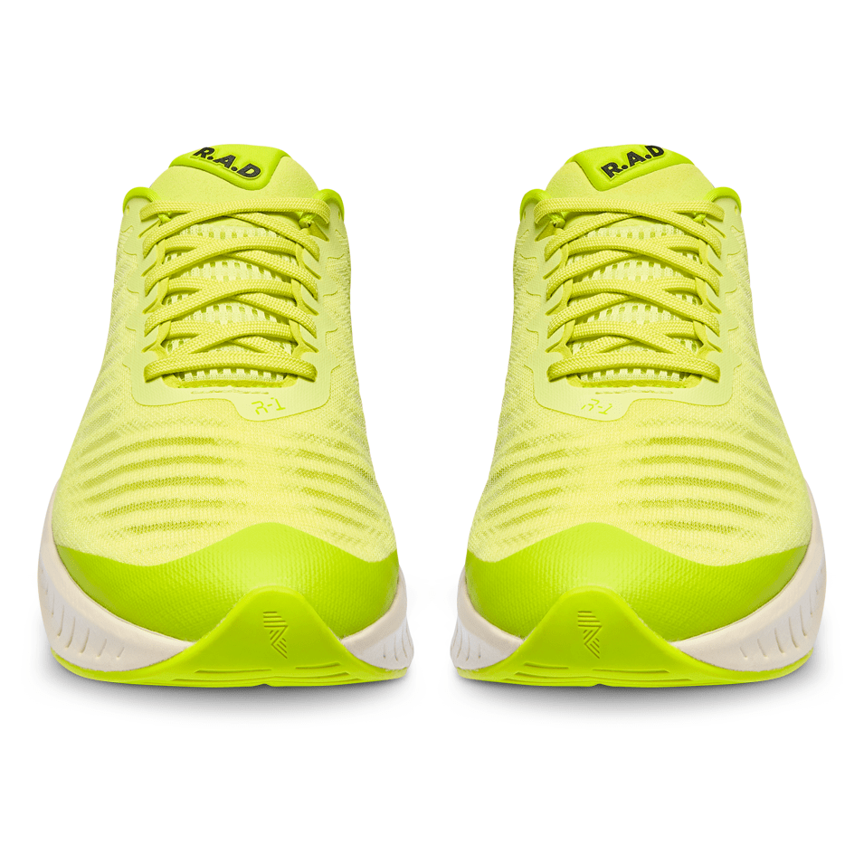 Pair of neon yellow running shoes.