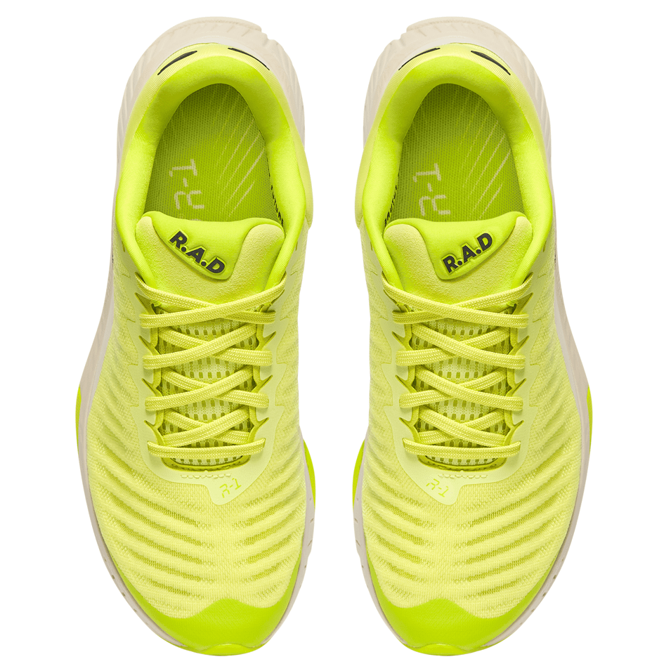 Pair of bright yellow running shoes.